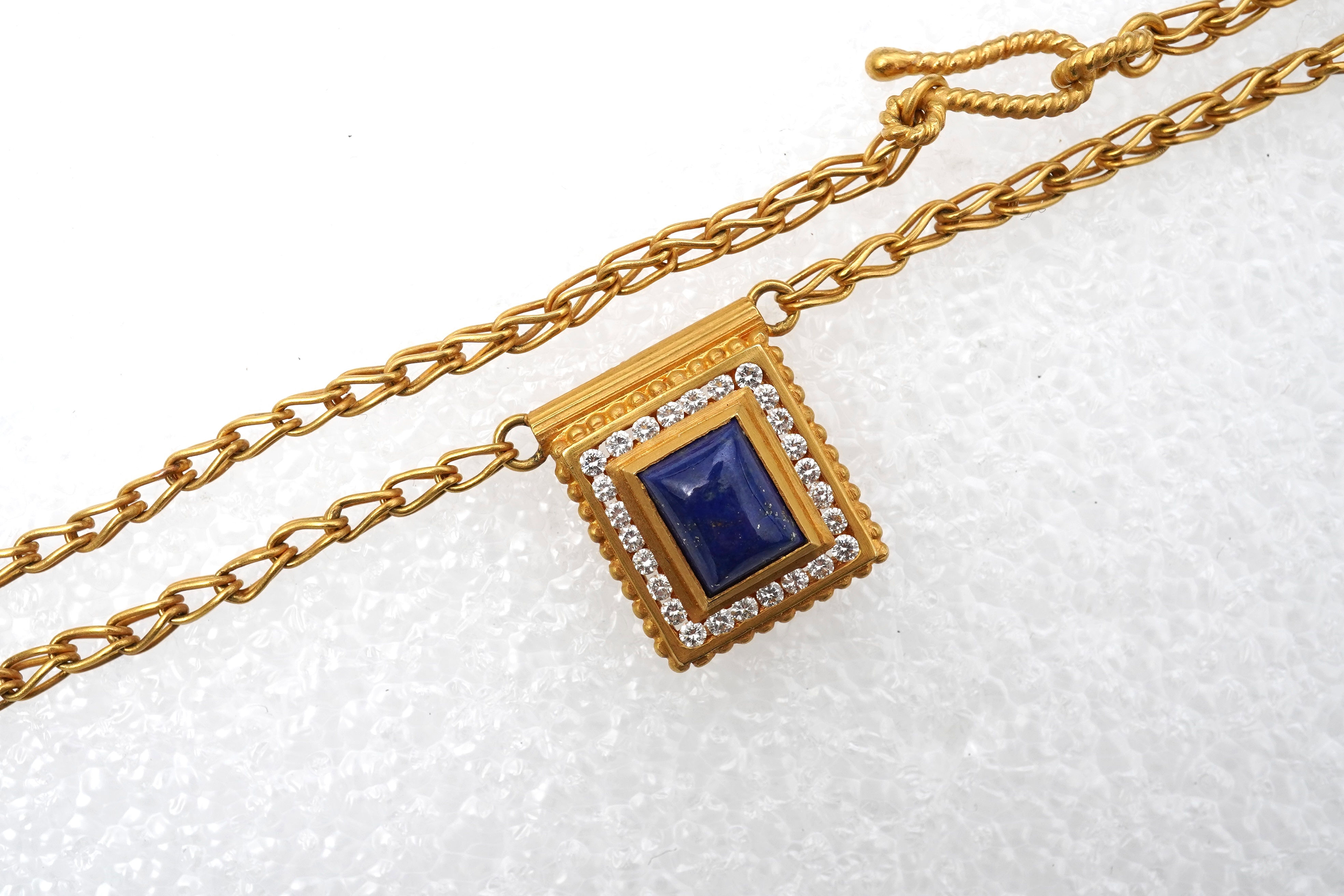 A lapis lazuli, gold and diamond demi-parure